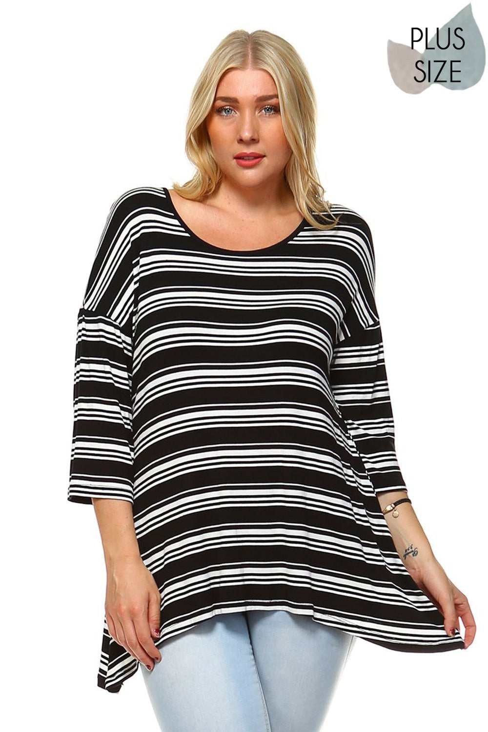 Beautiful woman wearing an Striped round neck 3/4 dropped sleeve top with asymmetrical hem. Perfect skirt for an effortless boho style, pair with boots for fall or your favorite sandals for summer. Festivals, Beach Day, Vacation