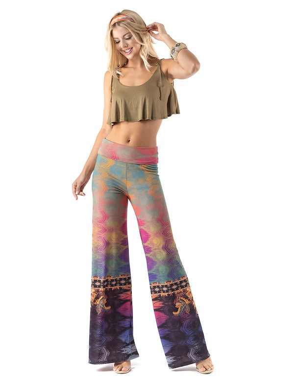 Beautiful woman wearing this amazing Multicolored Abstract High waist palazzo pants featuring pockets, wide legs, and a comfortable stretchy fabric perfect for Evening wear, Beach Day, Vacation, Dance, Poolside Parties,Casual day